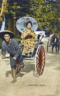 Spoked Prints: Japanese Woman with paper umbrella transported by Rickshaw