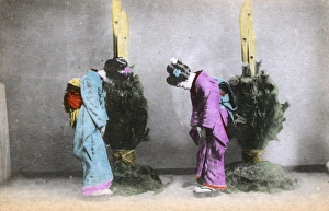 Two Japanese women greet each other with a bow Two Japanese women greet each other with a bow