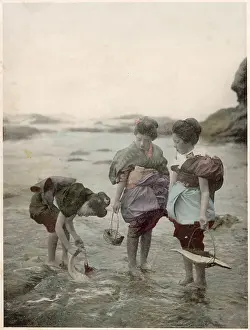 Japanese women picking shellfish at low tide Date: circa 1890s