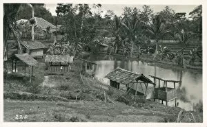 Images Dated 24th April 2019: Java, Indonesia - Small shelters on the riverbank