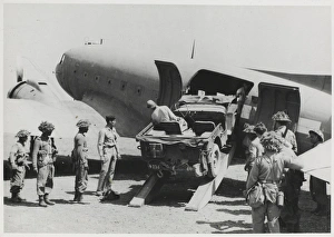 Dakota Gallery: Jeep being loaded into the fuselage of a Dakota transport pl