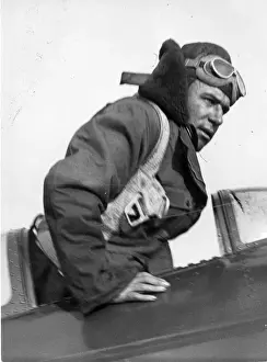Mollison Prints: Jim Mollison leaving the cockpit of his Bellanca Flash