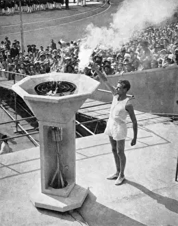 John Mark lights the Olympic bowl, opening ceremony, 1948