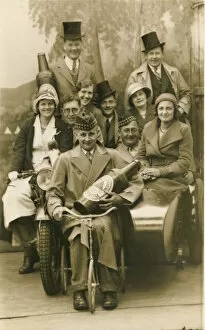 Prop Collection: A jolly group of holidaymakers pose for a photograph with prop beer bottle