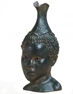 Jug shaped as black womans head. 4th-1st BC