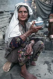 Vale Prints: Kashmir - senior woman in traditional dress eats from bowl