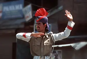 Kashmiri policeman on traffic duty in Srinagar, Kashmir