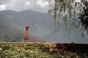 Jammu Prints: A Kashmiri woman with a basket and pot on her head