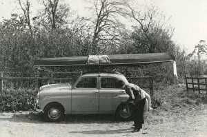 Images Dated 26th February 2019: Kayak on the roof of a small 1950s UK car