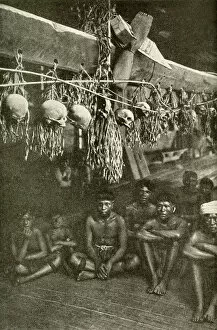 Enemies Collection: Kayan men in long house with skulls, Borneo, SE Asia