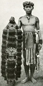 Kenyah man with his shield, Borneo, SE Asia Kenyah man with his shield, Borneo, SE Asia