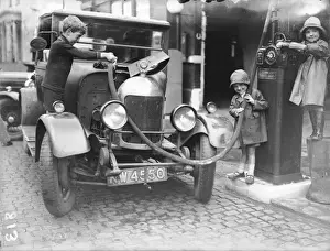 Kids Refuelling a Car
