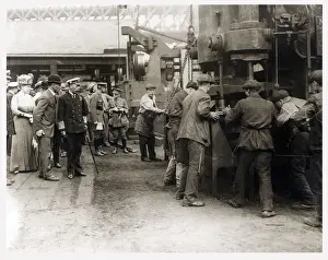 Hammer Prints: King George V (1865-1936) and Queen Mary (1867-1953) visit a factory workshop during