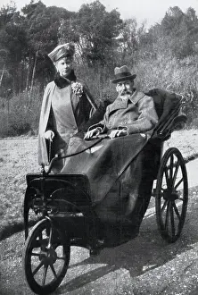 King George V (1865-1936) with Queen Mary in a bath chair (made 40 years previously for Queen Victoria) enjoying the Spring sunshine at Craigwell House, Bognor Regis, West Sussex. Date: 1929
