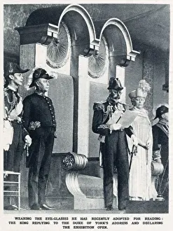 King George V, wearing the eye-glasses he had recently adopted for reading, replying to the Duke of York's address, and declaring the British Empire Exhibition at Wembley open. Date: 1925
