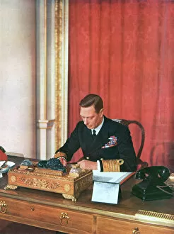 Desk Gallery: King George VI at his desk in naval uniform, 1942