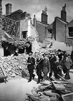 King George VI inspecting bomb damage in London
