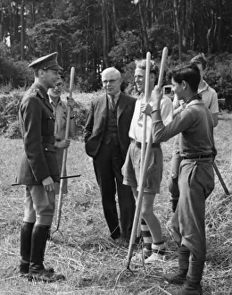 King George VI talking to wartime farm helpers