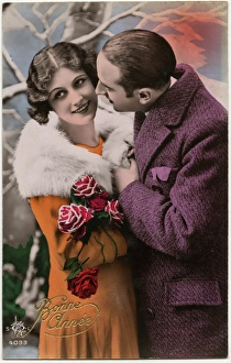 Kitsch New Years Greetings postcard featuring a young couple Kitsch New Years Greetings postcard featuring a young couple