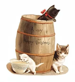 Images Dated 10th December 2015: Three kittens with barrel on a cutout Christmas card