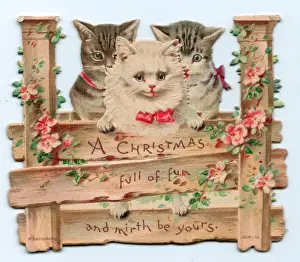 Three kittens on a cutout Christmas card