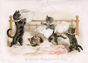 Four kittens pillow fighting on a New Year card