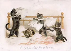 Pillow Prints: Four kittens pillow fighting on a New Year card