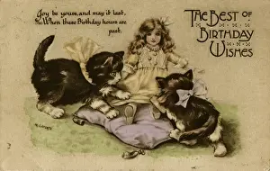 Two kittens playing with a doll on a birthday postcard