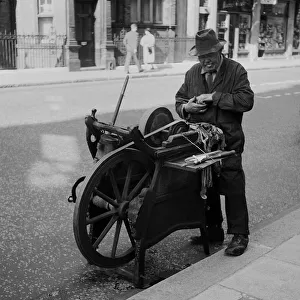Knife grinder at work, Central London