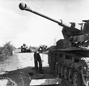 Two knocked-out German tanks blocked the road, and a diversion had to be constructed to