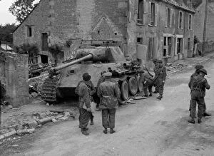 Examining Collection: Knocked-out Panter tank, destroyed by an infantry PIAT