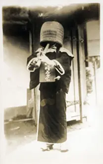 Buddhism Prints: Kobe, Japan - A komuso (monk of the Fuke sect) wearing a basket hat (tengai or tengui)