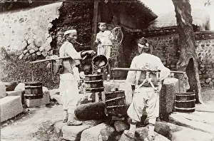 Seoul Prints: Korea: men taking water from a well