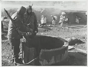Images Dated 17th November 2015: Korean War - two soldiers at well