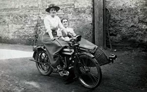 Wicker Gallery: Two ladies on a 1914 Triumph motorcycle
