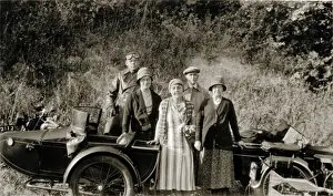 Ladies & gentledmen with their 1928 Royal Enfield motorcycle