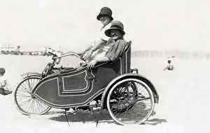 Two ladies on a veteran motorcycle