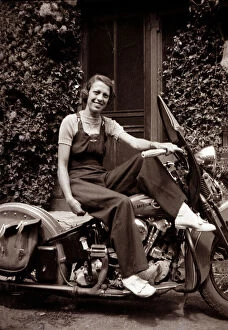 Lady on a 1939 / 40 Harley Davidson motorcycle