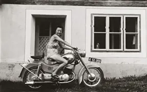 Lady on a 1958 / 9 Puch motorcycle