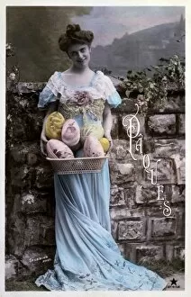 Inviting Collection: Lady in a blue dress with a basket of Easter eggs