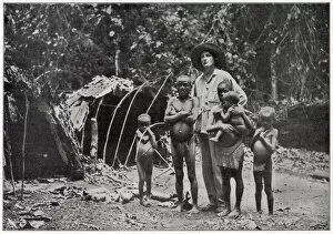 Images Dated 15th April 2021: Lady Broughton, travelling in southern Africa, poses with a family of pygmies