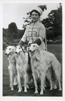 Images Dated 24th April 2019: Lady in elaborate costume with three Borzois