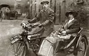 Wicker Gallery: Lady & gentleman sitting on a 1910 Triumph motorcycle