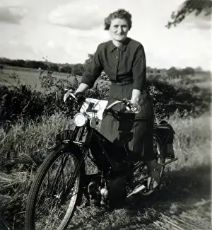 Lady learner on a 1930s / 40s Velocette motorcycle