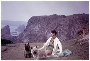 A lady with her two pet terriers - Rocky British coast