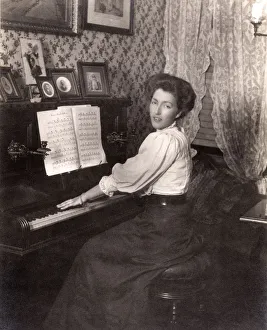 Images Dated 18th July 2018: Lady playing an upright piano in her front room