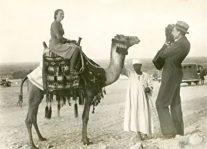 Lady Tourist on camel - Giza, Egypt