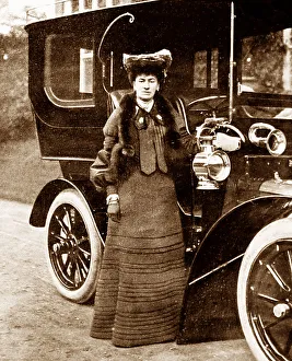 Lady and a veteran car, early 1900s