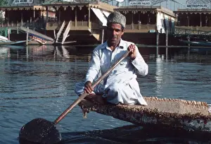 Jammu Prints: Lake Dal, Srinagar, Kashmir - a man paddling boat