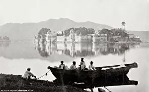 Fisherman Collection: Lake and Palace with a boat Udaipur, India